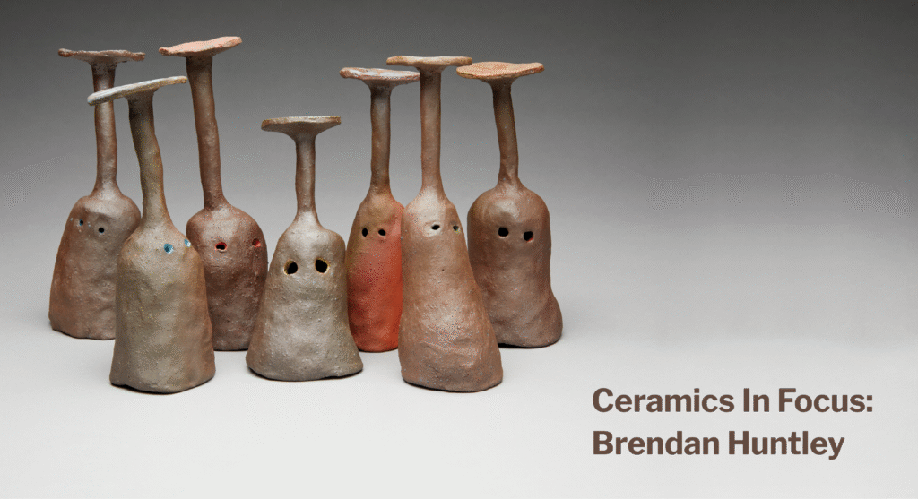 Banner image featuring seven brown ceramic goblets, each with a pair of eyes, positioned upside-down on a grey-gradient surface. Text to the right reads: Ceramics in Focus, Brendan Huntley