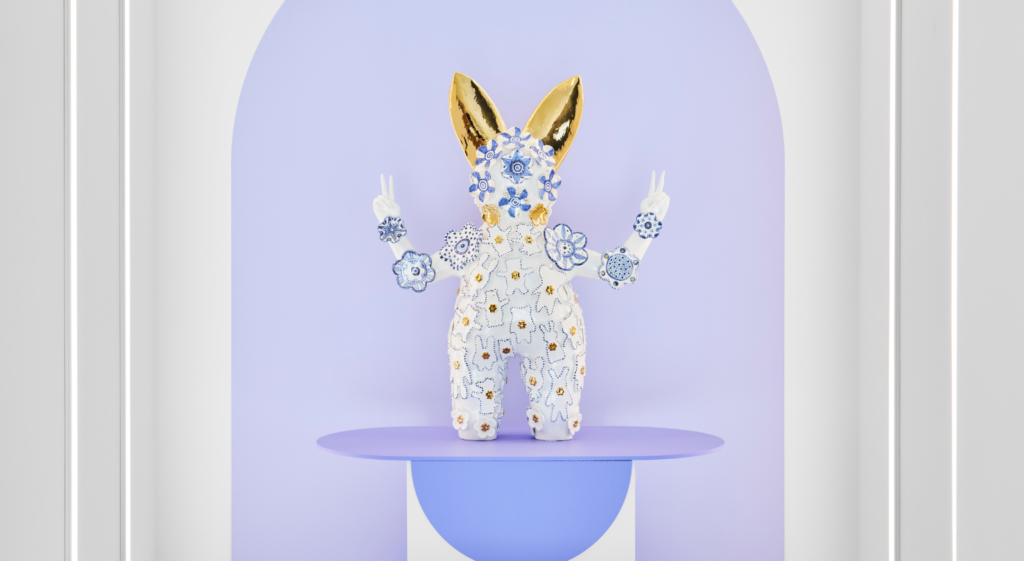 Photo of a porcelain sculpture in a museum display case